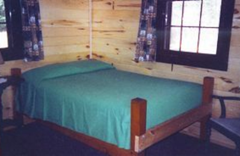 Cabin bed at Pine Grove Lodge.