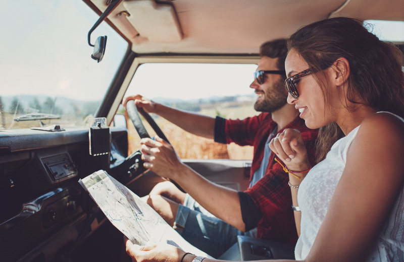 Couple traveling by car near Blu-tique Hotel.