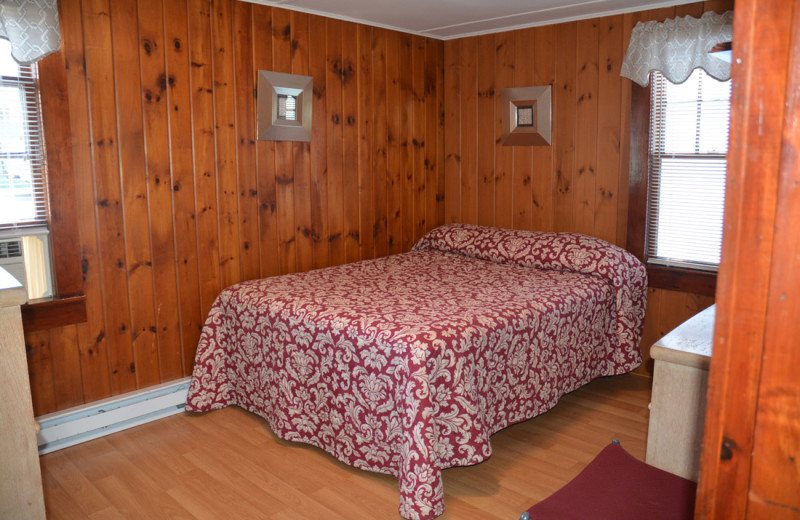 Cottage bedroom at Channel Waterfront Cottages.