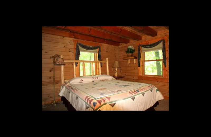 Cabin bedroom at Hummingbird Hill Cabin Rentals.