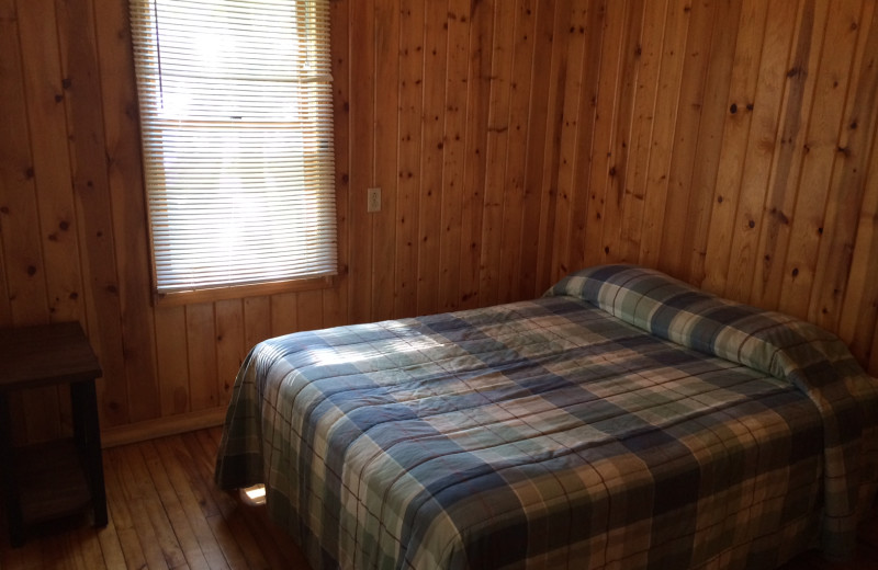 Cabin bedroom at Arnesen's Rocky Point Resort.