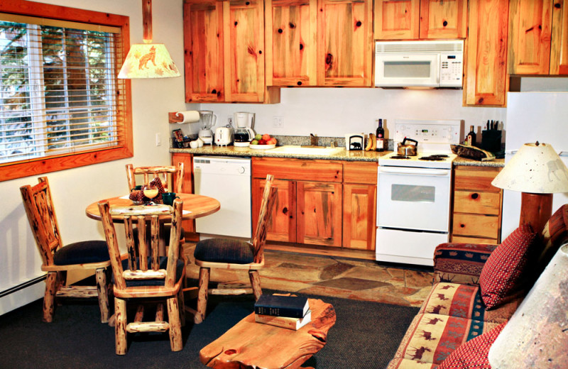 Dining Area and Kitchen of a One Bedroom Unit at the Red Wolf Lakeside Lodge