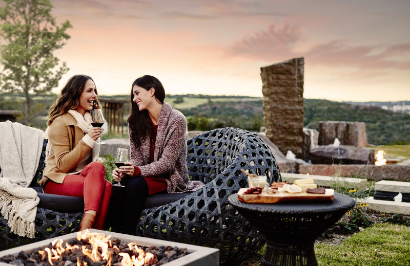 Couple by bonfire at La Cantera Resort & Spa.