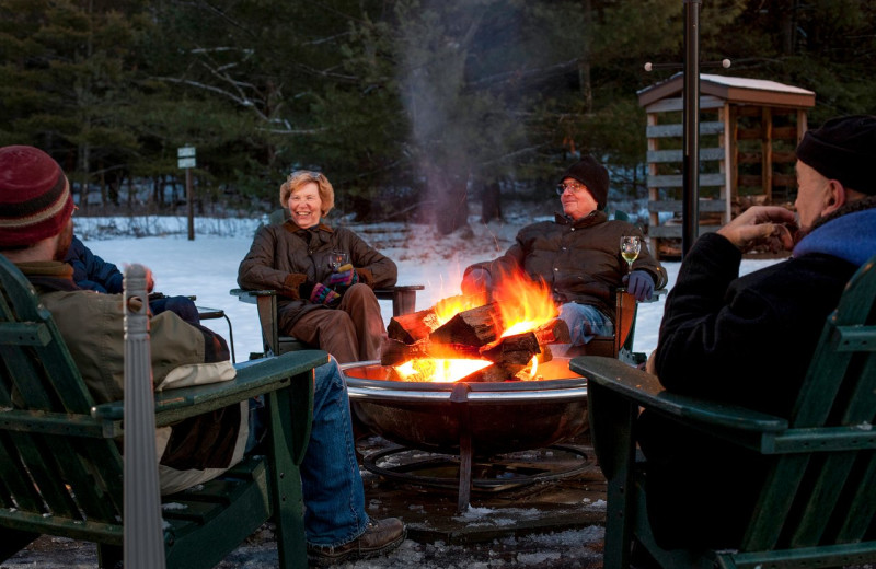 Group by fire pit at Inn At Lake Joseph.