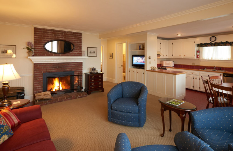 Guest fireplace living room and kitchen at The Sparhawk Oceanfront Resort.