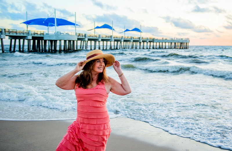 Fishing pier and beach at Beach Vacation Rentals.