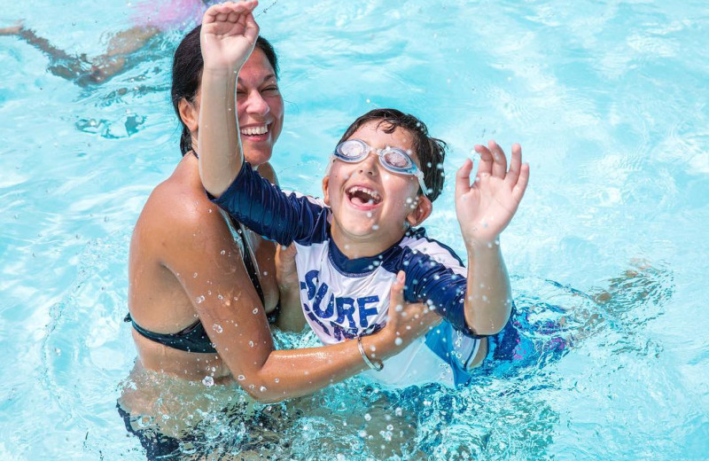 Family in pool at Great Blue Resorts- Lantern Bay Resort.