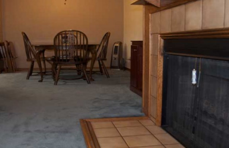 Guest fireplace and dining room at Copper Chase Condominiums.