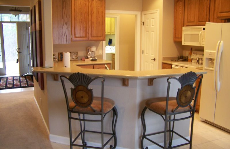 Rental kitchen at Village Villas Vacation Rentals.