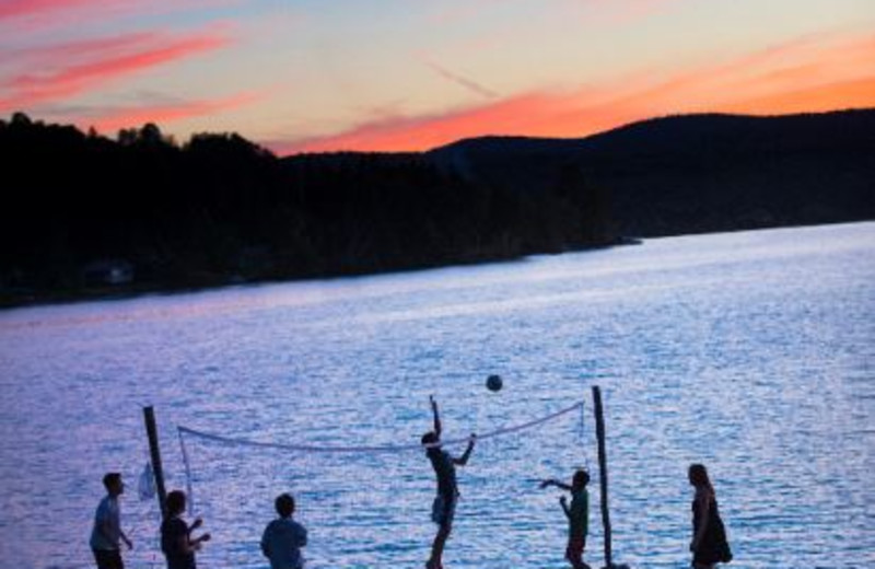 Volley ball on the sandy beach at Jackson's Lodge, on the shores of pristine international Wallace Pond in Canaan, Vermont.