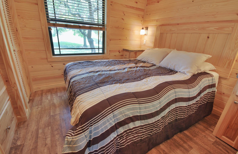 Cottage bedroom at Yogi Bear's Jellystone Park™ Camp-Resort Hill Country.