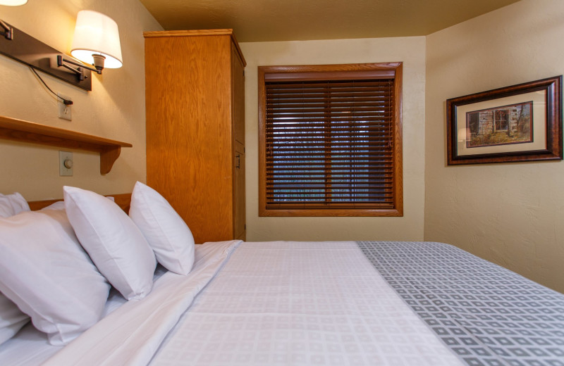 Guest bedroom at Waterbury Inn Condominium Resort.