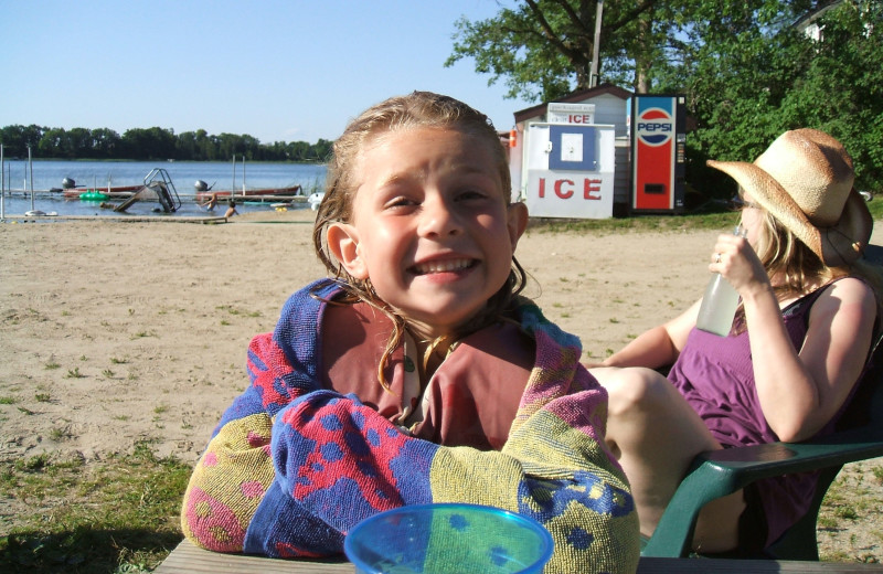 Kid on beach at Sunset Bay Resort.