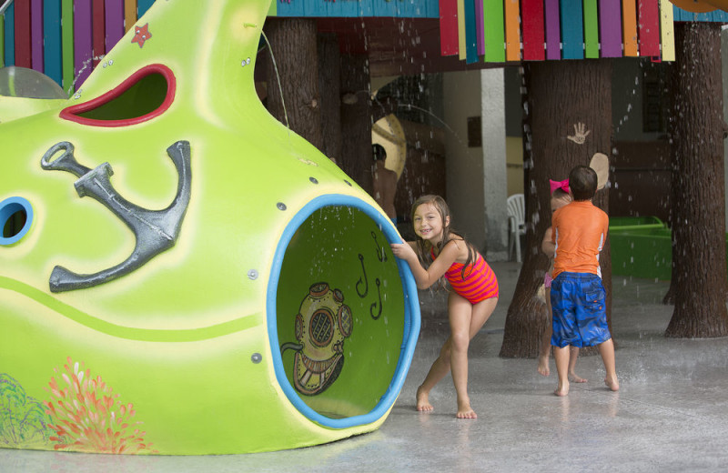 Kids in water park at Crown Reef Resort.