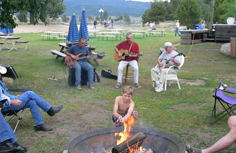 Family around the fire at The Ashley Inn.