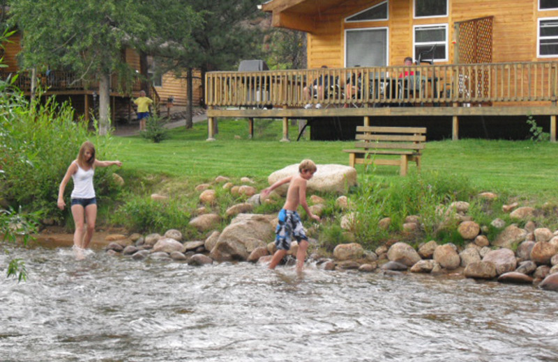 Kids playing in the river at Riverview Pines.