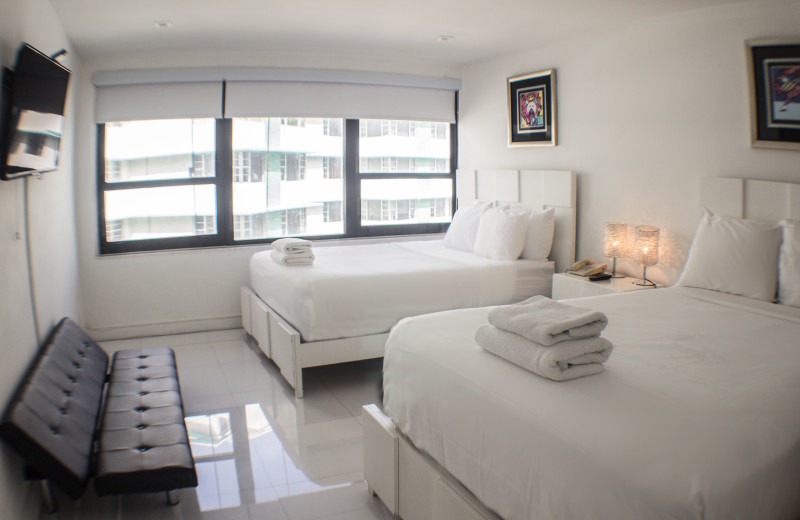 Guest bedroom at The Alexander All Suite Oceanfront Resort.