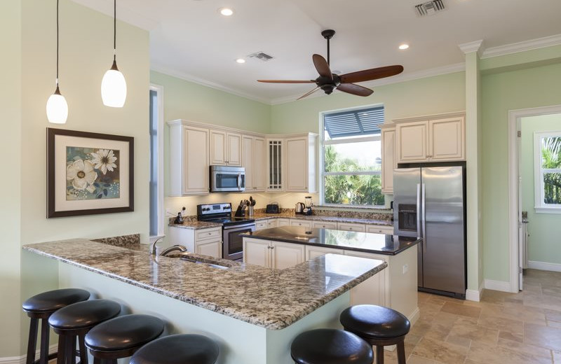 Rental kitchen at Sun Palace Vacation Rentals.