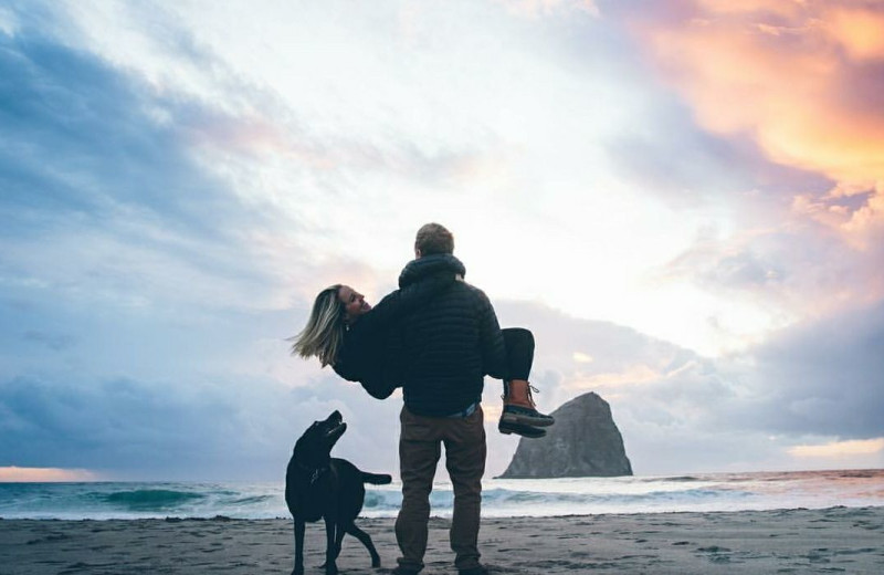 Couple on beach at Shorepine Vacation Rentals.