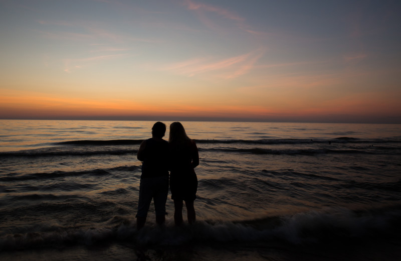 Couple on beach at Econo Lodge - St. Joseph.