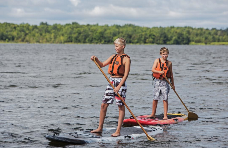 Paddle board at Great Blue Resorts- Woodland Estate Resort.