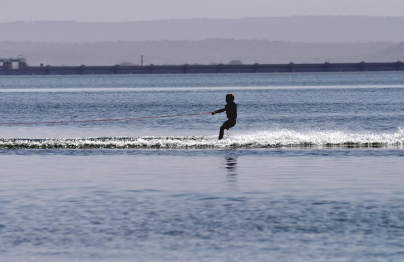 Surfing on the beach at Willow Point Resort.