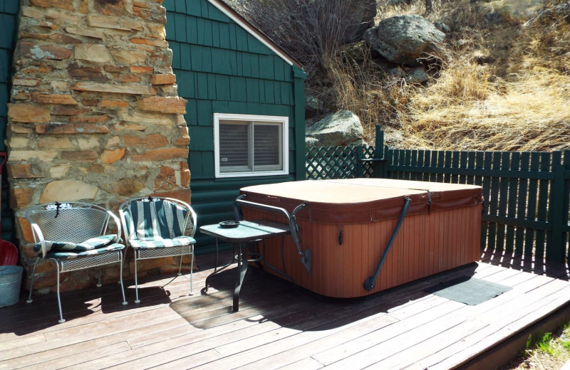 Cabin hot tub at Rustic River Cabins.