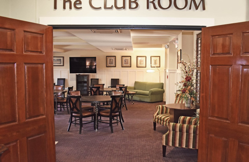 Meeting room with fixed round table seating for 20 people at Inlet Sports Lodge.