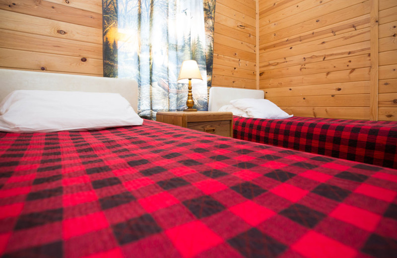 Guest cabin bedroom at River Bend's Resort & Walleye Inn.