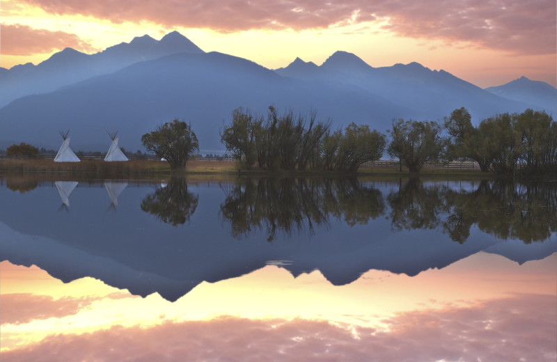 Mountains and teepees at Ninepipes Lodge.