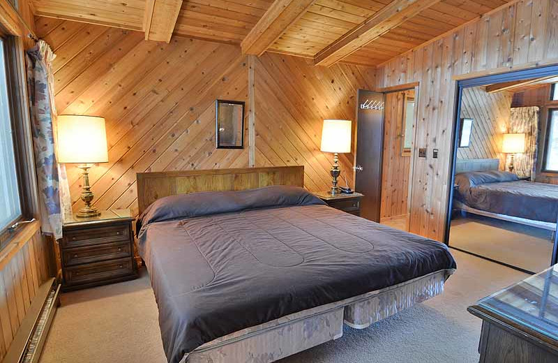 Cabin bedroom at North Country Vacation Rentals.