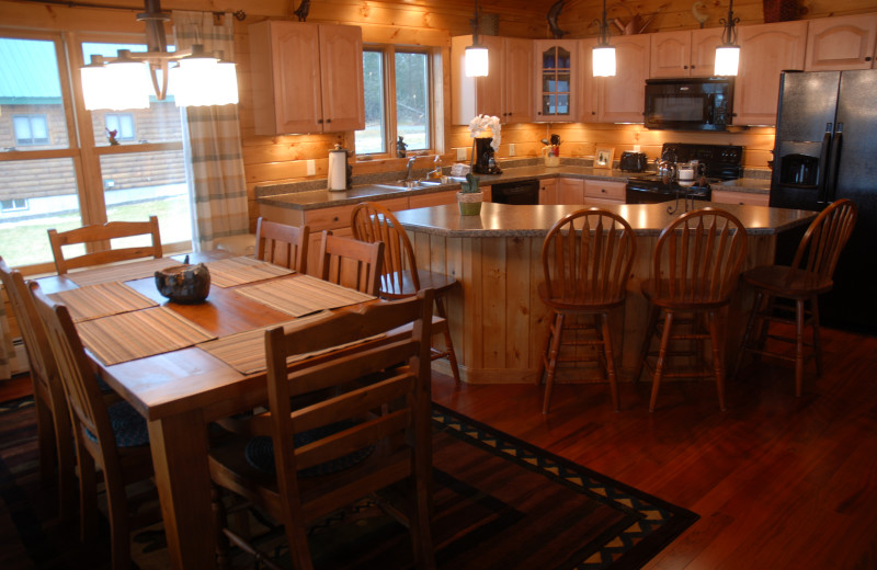 Cabin dining and kitchen at Cabins at Lopstick.