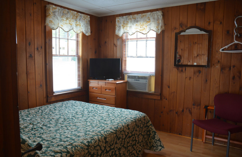 Cottage bedroom at Channel Waterfront Cottages.