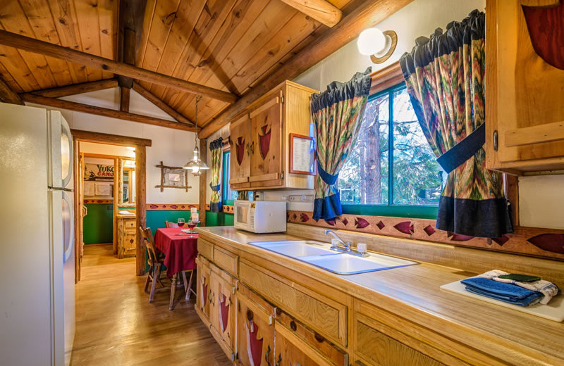 Cabin kitchen at Arrowhead Pine Rose Cabins.