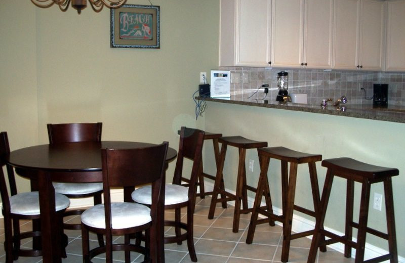 Rental kitchen and dining at Gulf Beach Rentals.