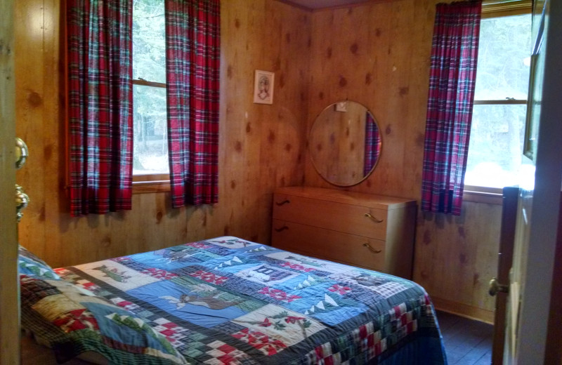 Cabin bedroom at The Arrows Resort.