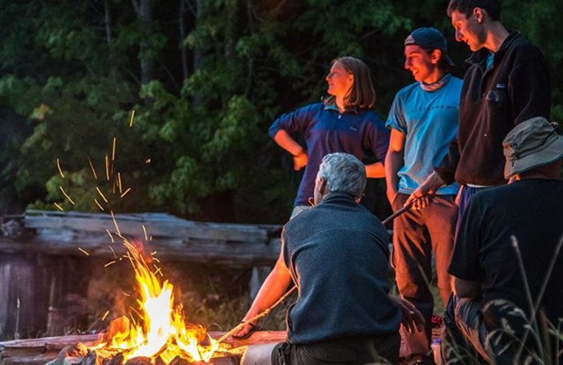 Group around the fire at Orca Camp.