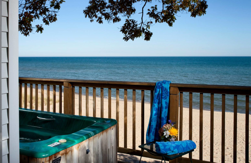 Guest hot tub and beach view at Huron House.