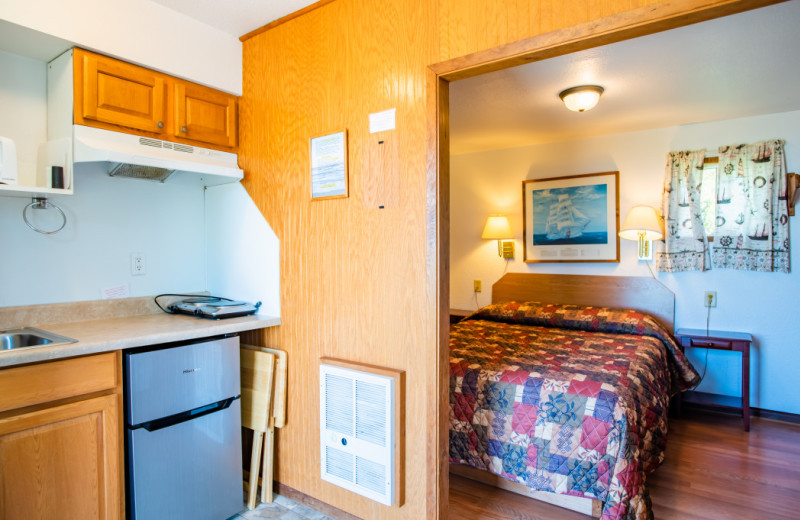 Cabin kitchen and bedroom at Oceanside Ocean Front Cabins.