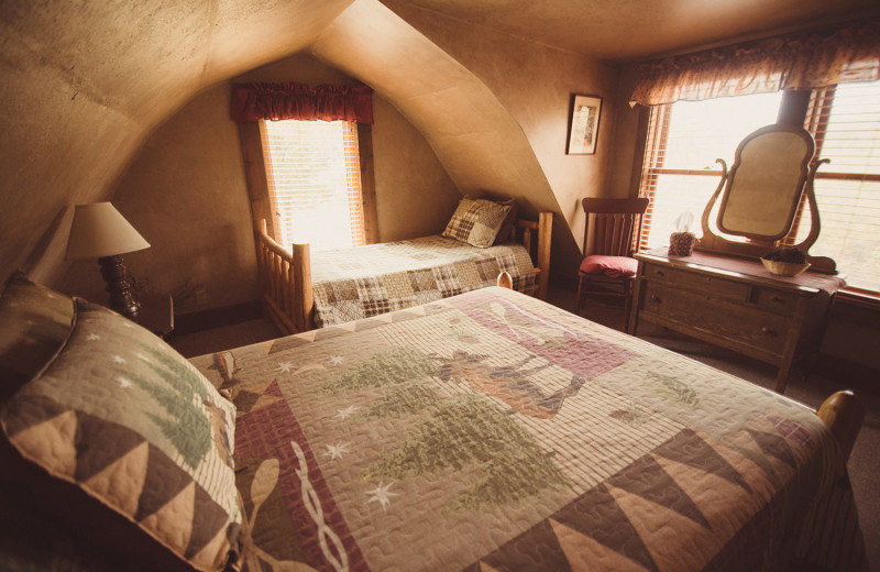 Guest cabin bedroom at Vee Bar Guest Ranch.