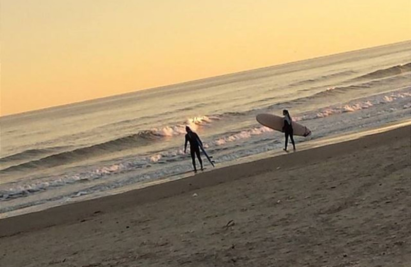 Surfing on the beach at The House Company.