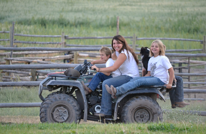 Family on ATV at Rocking Z Ranch.