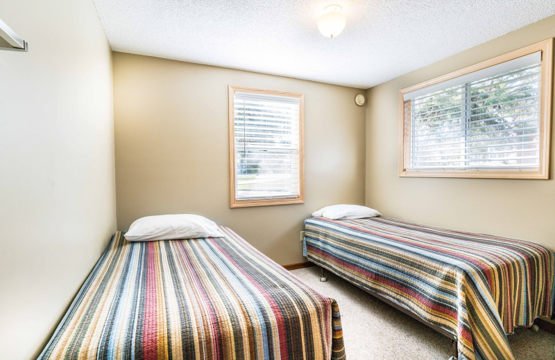 Cabin bedroom at Otter Tail Beach Resort.