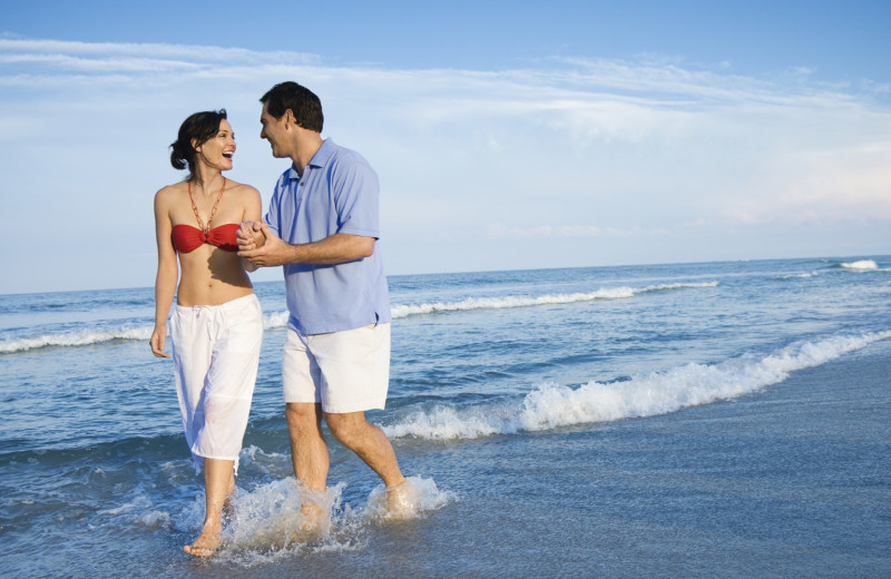 Couple on beach at Sterling Resorts.