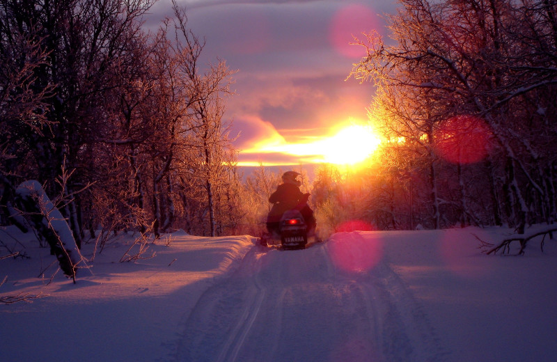 Snowmobiling at Owls Nest Lodge.