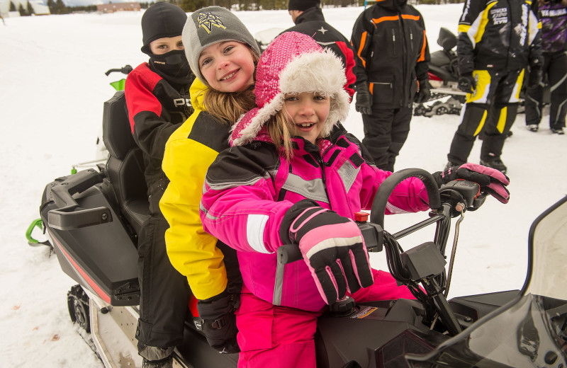 Snowmobiling at Wild Skies Cabin Rentals.