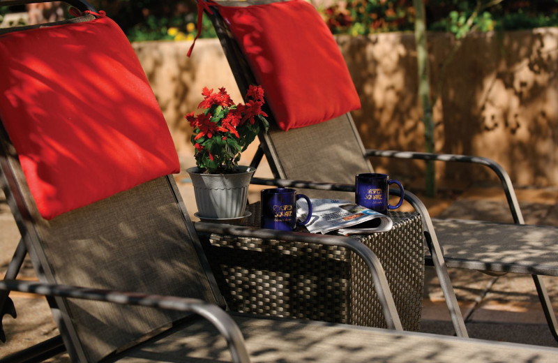 Pool chairs at Aspen Square Condominium Hotel.