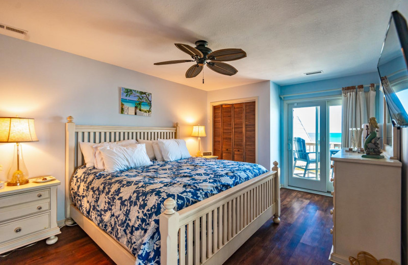 Rental bedroom at Joe Lamb Jr. & Associates Vacation Rentals.