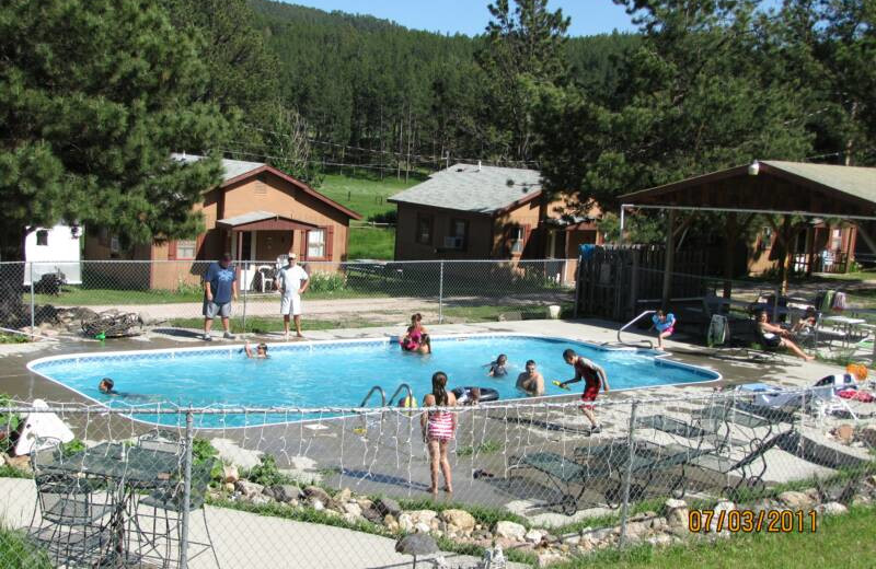 Outdoor pool at Black Hills Cabins & Motel at Quail's Crossing.