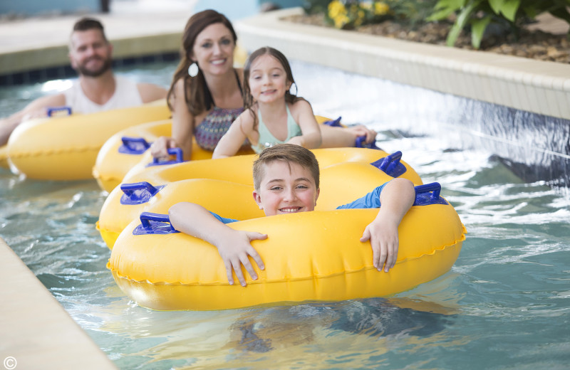 Family in lazy river at Landmark Resort.